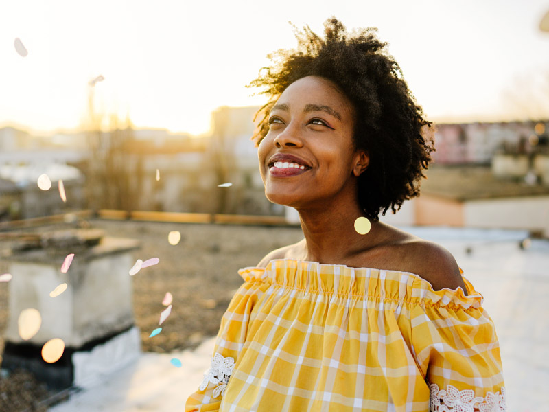 woman smiling while outside